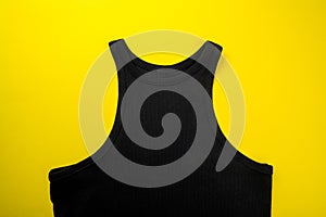 Price tag hang over black t-shirt on  yellow background - Image