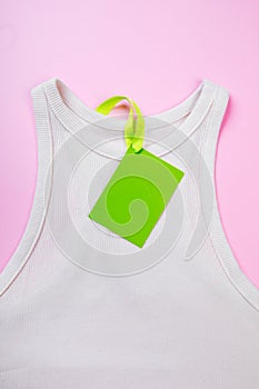 Price tag hang over white  t-shirt on  pink background - Image