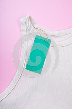 Price tag hang over white  t-shirt on  pink background - Image