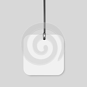 Blank paper price tag with string and rounded corners.