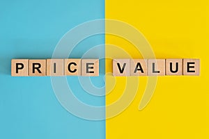 Price versus value in business and consumerism concept. Wooden blocks typography in blue and yellow background.