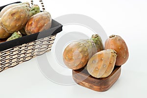 Prickly pear cactus fruits - Opuntia ficus indica; photo on neutral background