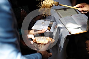 Priest blessing wedding rings