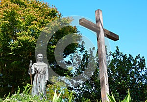 Priest and Cross Statue