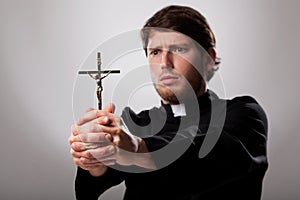 Priest with cross photo