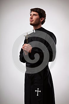 Priest with cross photo