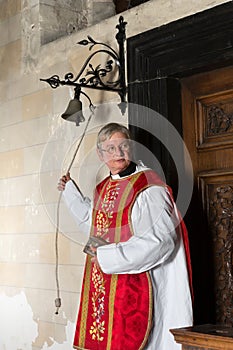 Priest entering church