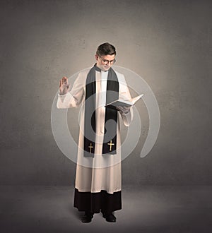 priest in giving his blessing