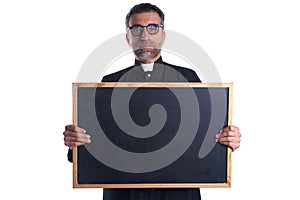 Priest holding empty blackboard copy space