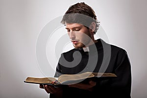 Priest with Holy Bible