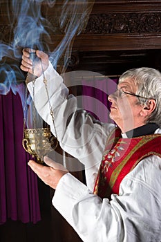 Priest with incense burner