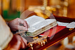 priest at the Lectern. table on which liturgical books are placed