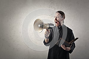 Priest with megaphone