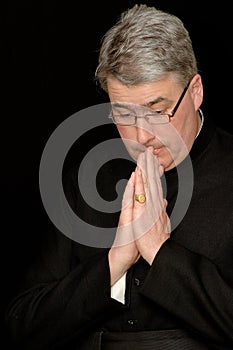 Priest in prayers photo