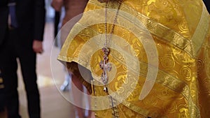 Priest praying in a cathedral, religious ceremony