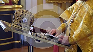 Priest praying in a cathedral, religious ceremony