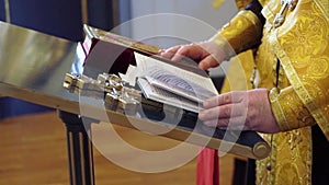 Priest praying in a cathedral, religious ceremony