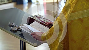 Priest praying in a cathedral, religious ceremony