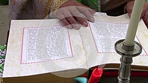 Priest reading Bible