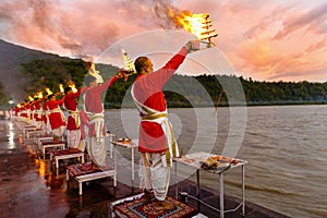 Priest in red robe in the holy city of Rishikesh in Uttarakhand,