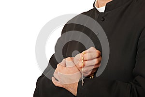 Priest's hands with rosary