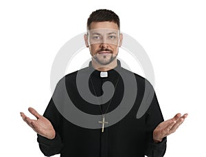 Priest wearing cassock with clerical collar on white background photo