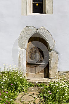 Priests entrance door in the back of the church photo