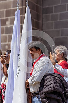 Priests and members of the Catholic church perform a procession