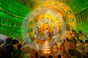 Priests praying to Goddess Durga, Durga Puja festival celebration inside Durga Puja Pandal.