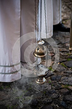 Priests are seen with candlesticks during a procession in honor of Santa Barbara in the city of Salvador, Bahia