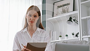 Prim psychologist woman in clinic office professional portrait