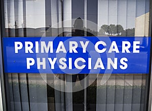 Primary Care Physicians Sign on a the Window of a Commercial Building photo