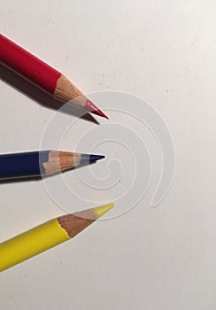 Primary colors pencils oon white paper