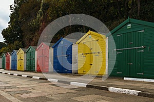 Primary colour beach huts in a row