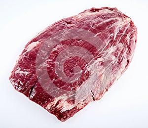 Prime cut of raw matured beef flank steak photo