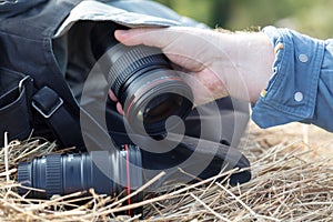 Prime photographic lens on hyestack, nature photographer concept