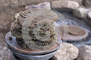 Primitive acorn cakes cooked in outdoor fire