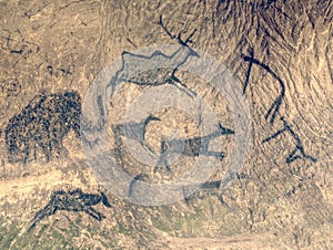 Primitive art painted on rock in sandstone cave