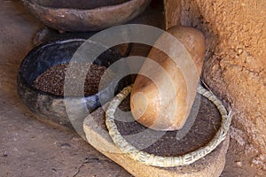 Primitive grinding stone in adobe hut