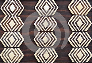 Primitive tribal art brown & ivory wood trivet