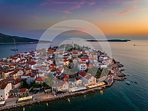 Primosten, Croatia - Aerial view of Primosten peninsula and old town on a sunny summer morning in Dalmatia, Croatia photo