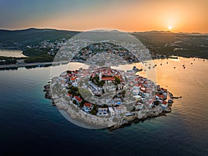 Primosten, Croatia - Aerial view of Primosten peninsula and old town on a sunny summer morning in Dalmatia, Croatia