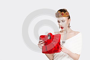 The princess looked into the red bag and was surprised to forget lost something has no more money. White light grey background
