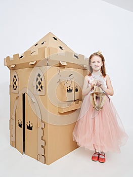 The princess play with cardboard castle tower.