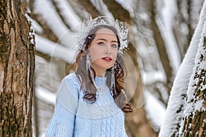 Princess Snow White in the winter forest. Fairy-tale character in bright outfits. A sweet and modern story with emotions