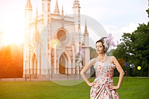 Princess in an vintage dress before the magic castle