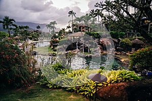 Princeville, Kauai, HI - April 24, 2023 - The Westin Resort pool and cabana at sunset in Princeville