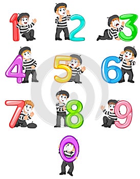 The collection of the little pantomime boy with the 0 - 9 balloon number with the different posing photo