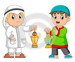 Two Moslem man holding lantern photo