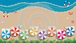 Beach and sea background with copy space. Aerial view of a beach with umbrellas of blue, green, purple, towels with colored stripe